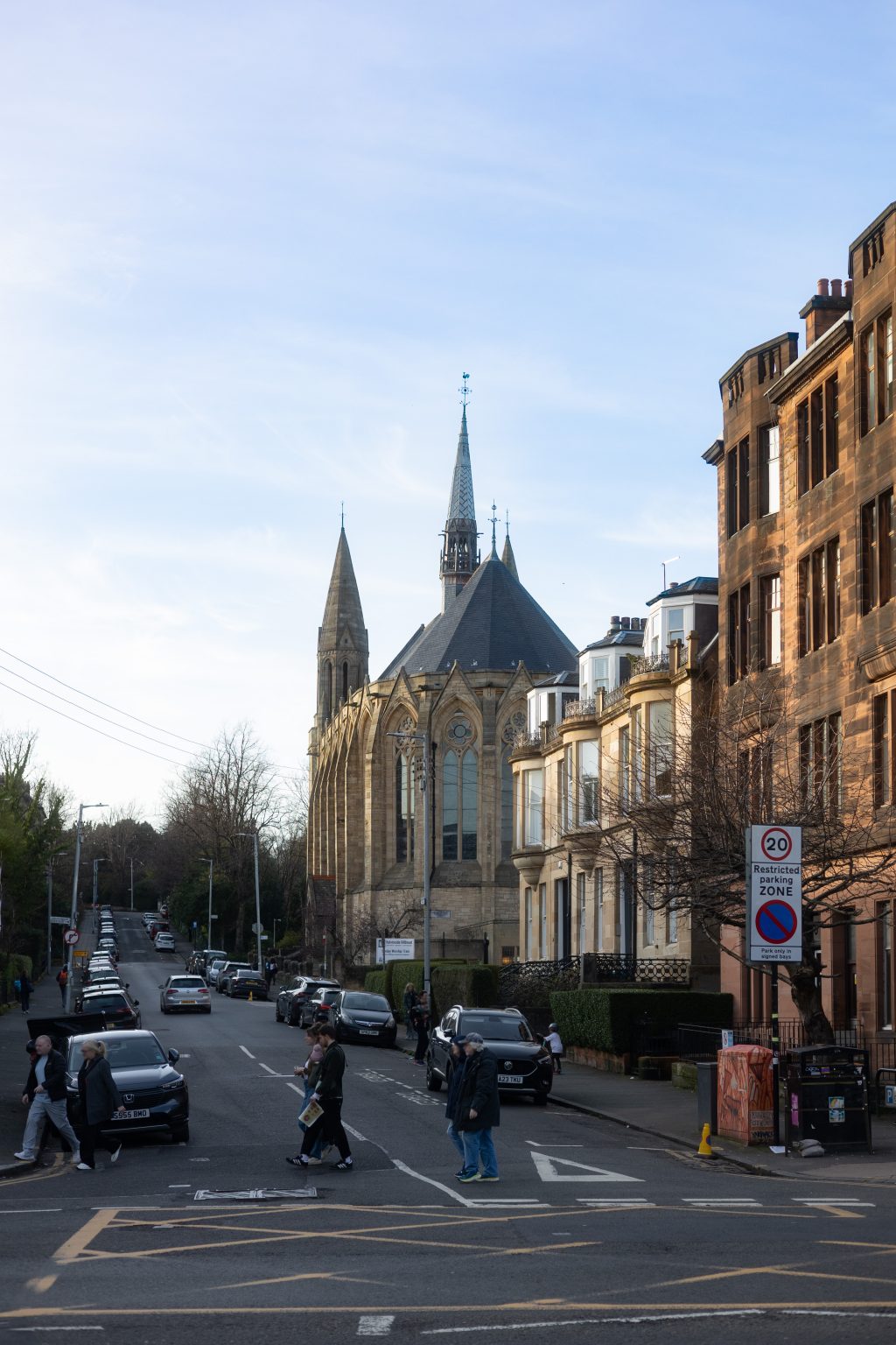 Loudon Terrace, Dowanhill, Glasgow, cars, pedestrians and Kelvinside Hillhead Parish Church in the background