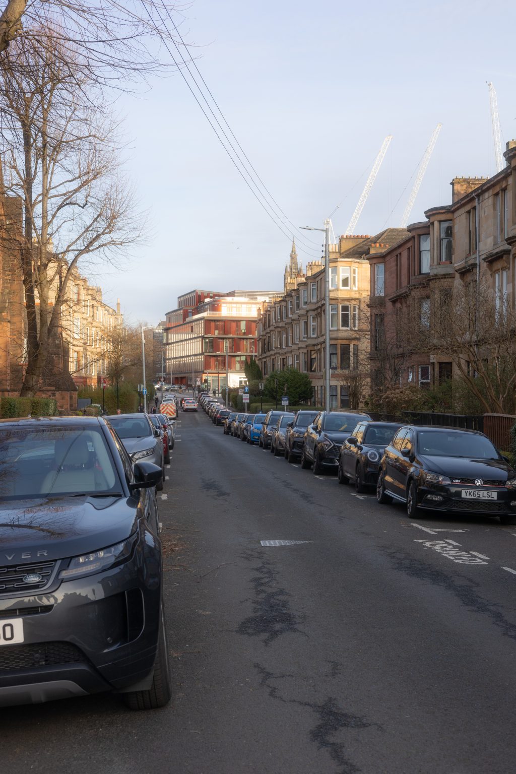 Lawrence Street, Dowanhill, Glasgow blue sky, cars, Glasgow University modern campus in the background