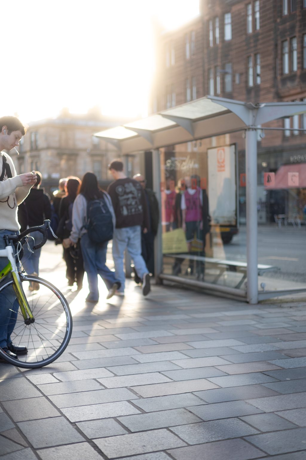 Byres Road, Hillhead, Glasgow, Bus shelter with students and a cyclist