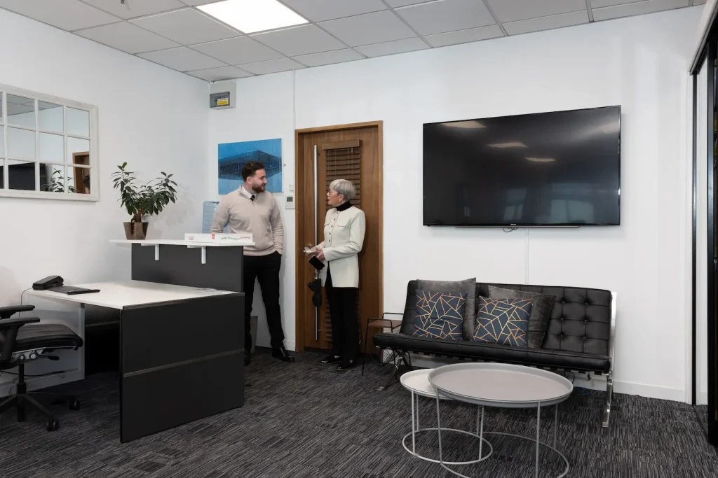 Two members of the Infiniti Properties team at reception in the Glasgow office